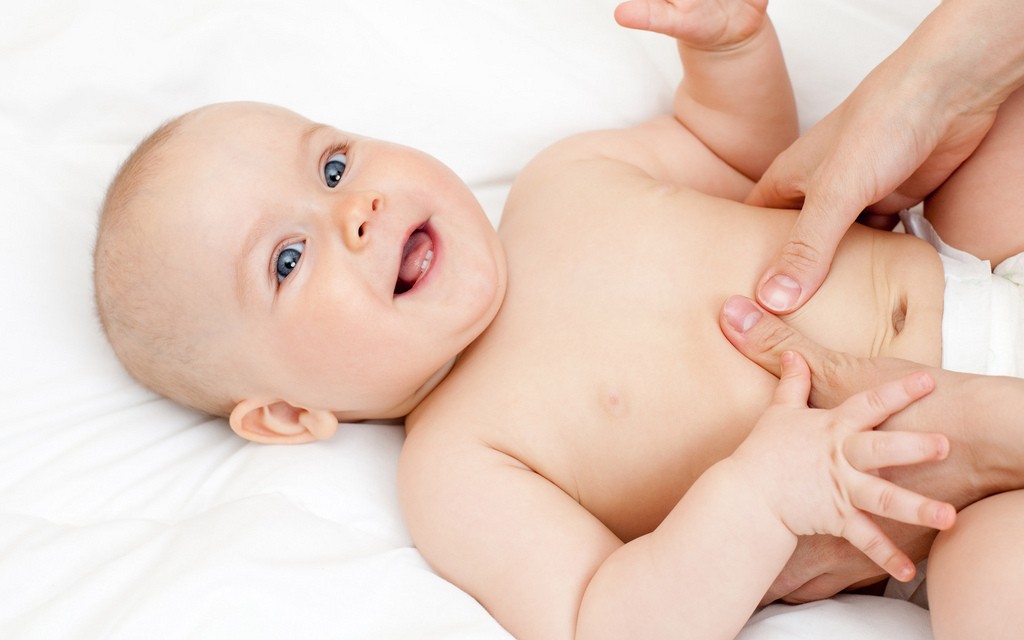 Mother massaging her child, shallow focus