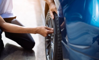 Maintenance male checking and removing tire valve filling nitrogen service on street at gas station, Safety vehicle to reduce accidents before a long travel, Blue car of man transportation lifestyle