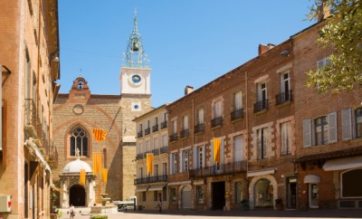 Catalan flags hanging at medieval Cathedral Basilica of Saint John the Baptist of Perpignan