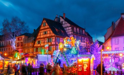 Traditional old half-timbered houses in the historic city of Colmar. Decorated and lighted during the Christmas season. Alsace. France.