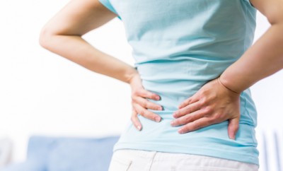 back pain at home. women suffer from backache. healthcare and medical concept