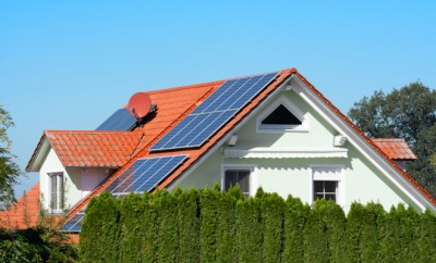 Modern house with photovoltaic solar cells on the roof for alternative energy production