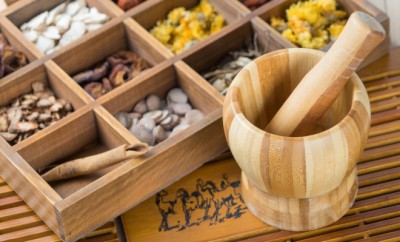 Chinese Herbal Medicine in box on table.