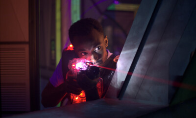 laser gun player shooting in futuristic labyrinth